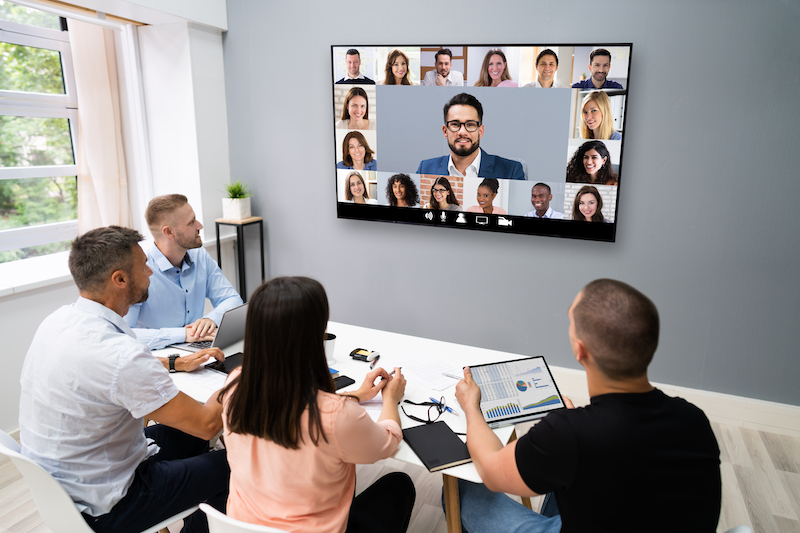 co-workers having a video conference with other people